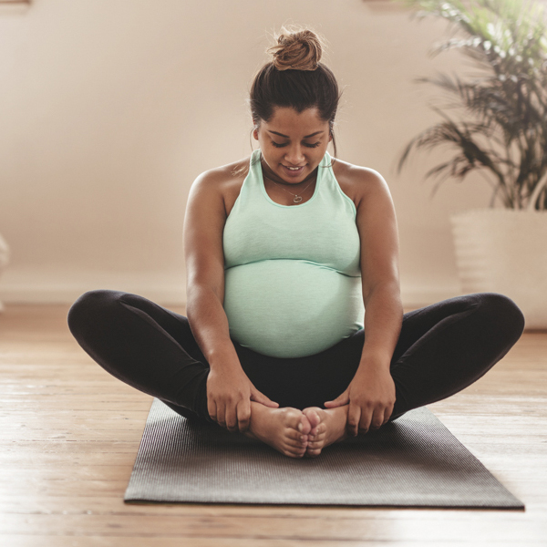 Pregnant woman sitting in a prenatal class